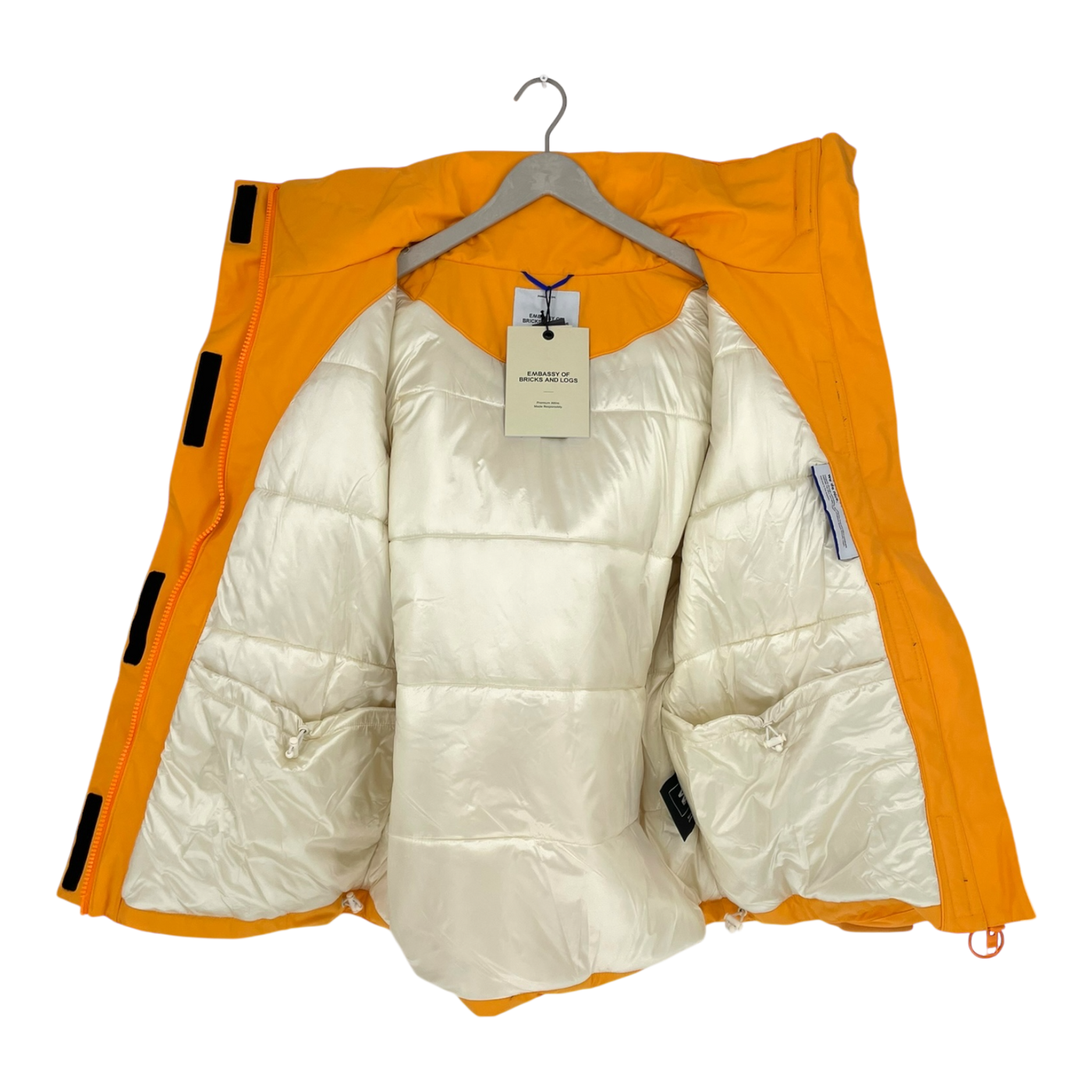 Embassy of Bricks and Logs norfolk parka, orange | unisex S