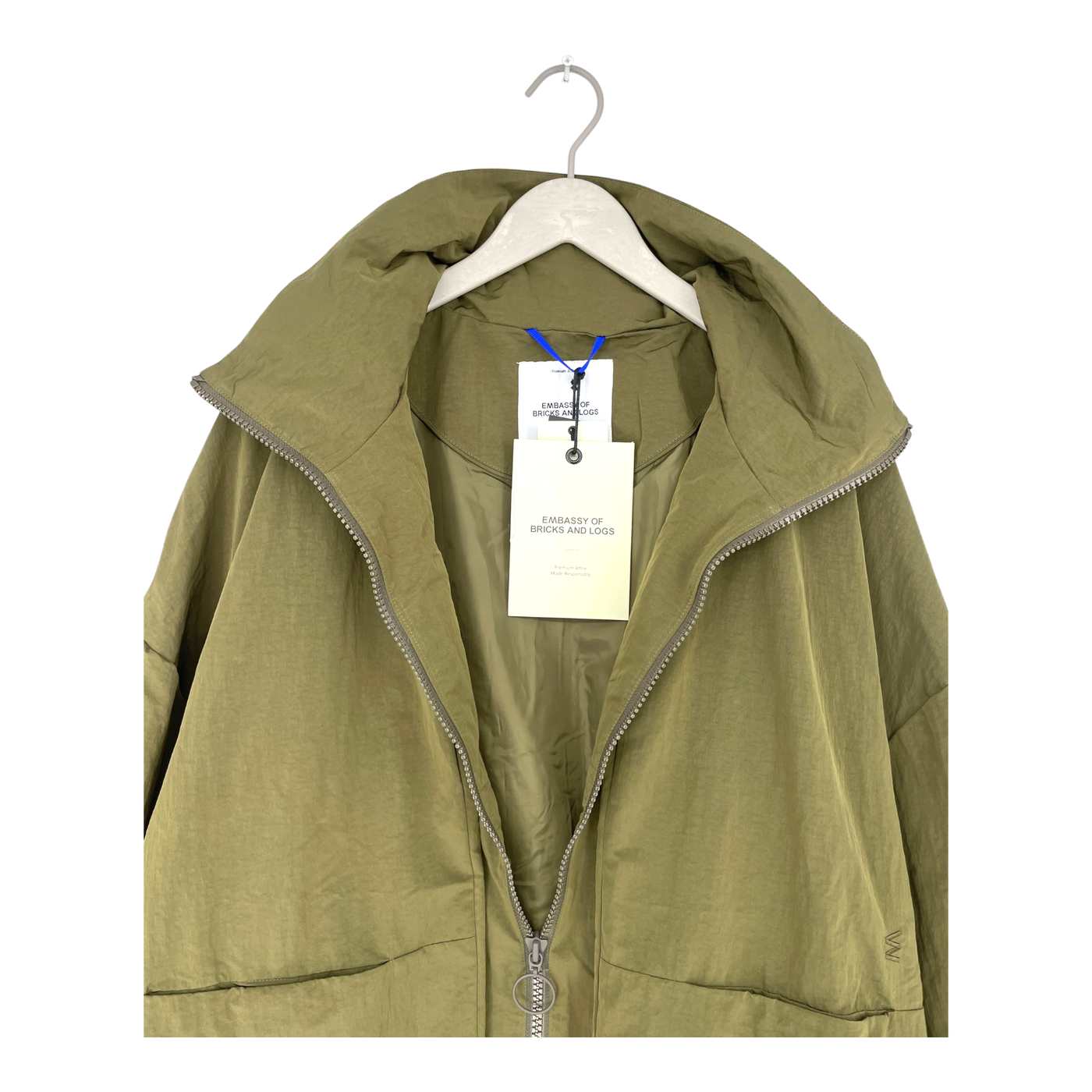 Embassy of Bricks and Logs vista raincoat, green | unisex S